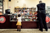 Al Jazeera feature on the Ponte Building and surrounding areas in Johannesburg CBD, South Africa. A little girl reaches for sweets in the butchery/supermarket, inside Ponte. . Picture: Cornel van Heerden/Al Jazeera